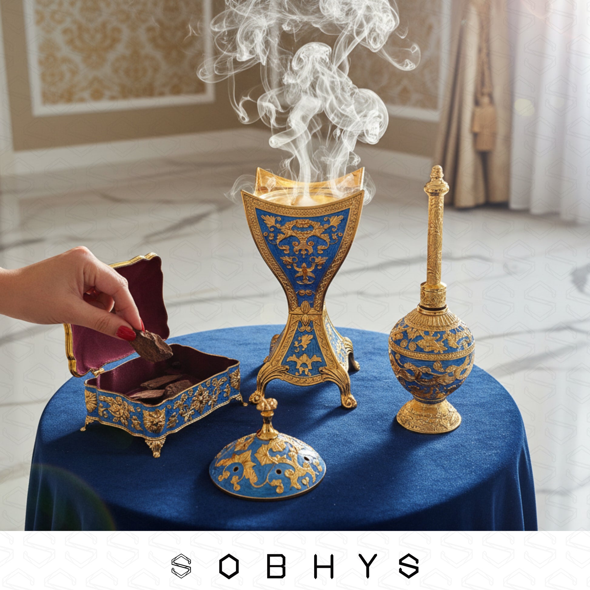 3-piece Arabic incense burner set components laid flat Royal Blue Gold
Decorative blue and gold incense burner set with smoke on a table, SOBHYS brand visible.