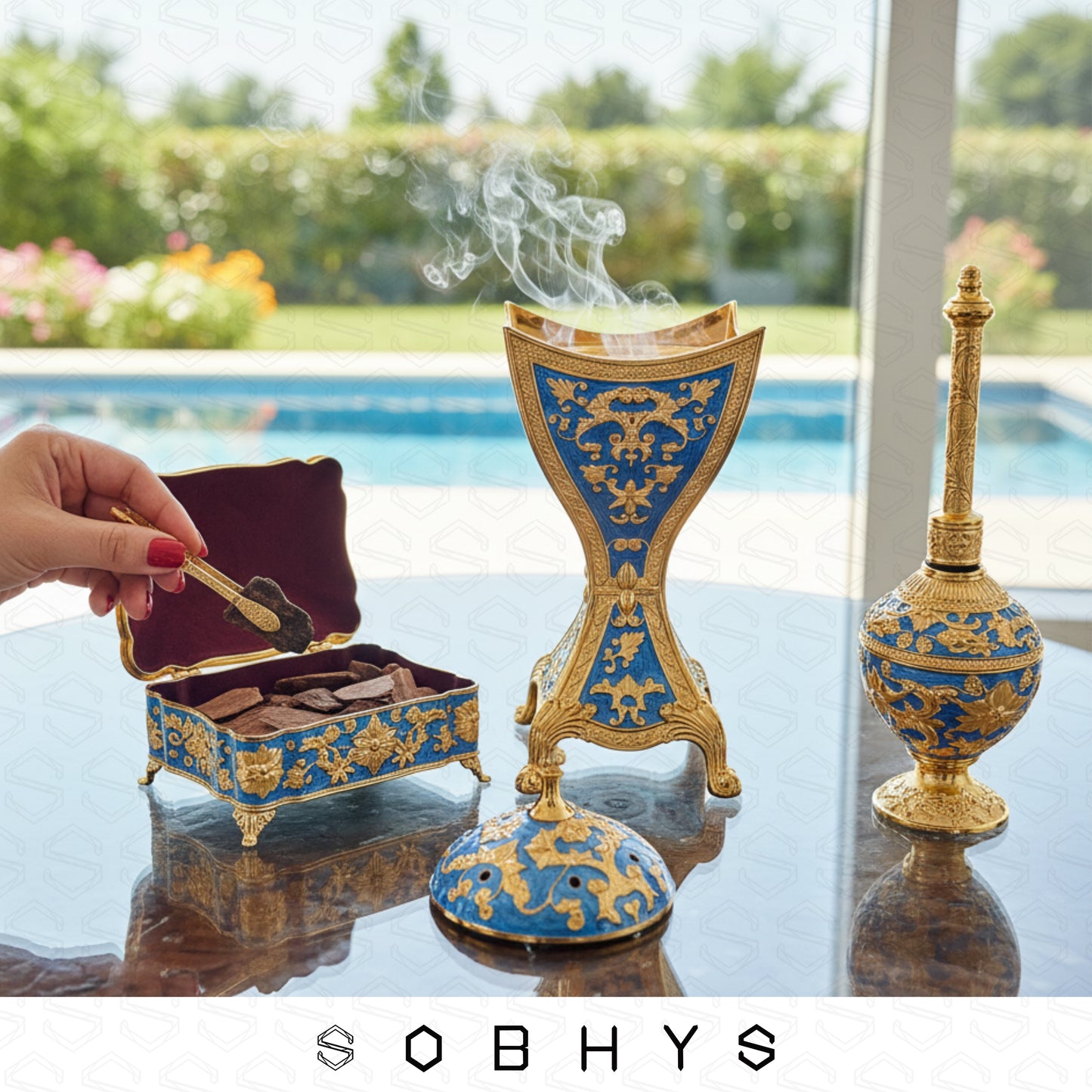 Luxury Arabic incense gift set Royal Blue Gold Sobhys limited edition
Decorative incense burner with intricate blue and gold design on a reflective surface, with 'SOBHYS' branding.