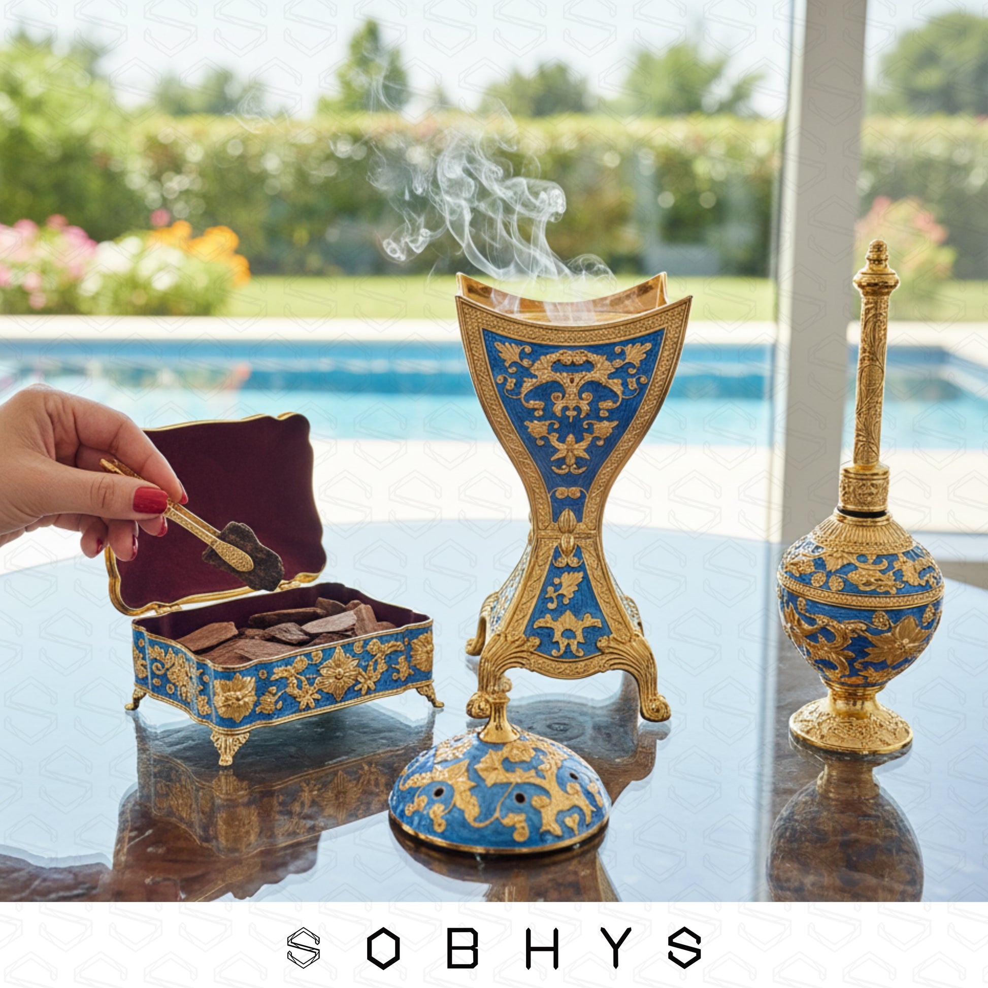 Luxury Arabic incense gift set Royal Blue Gold Sobhys limited edition
Decorative incense burner with intricate blue and gold design on a reflective surface, with 'SOBHYS' branding.